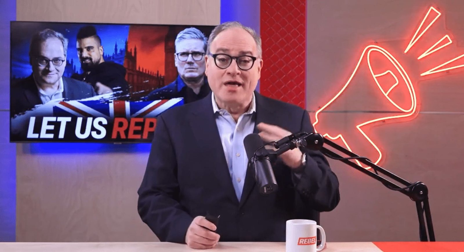 Tommy Robinson’s right-hand grifter banned from UK